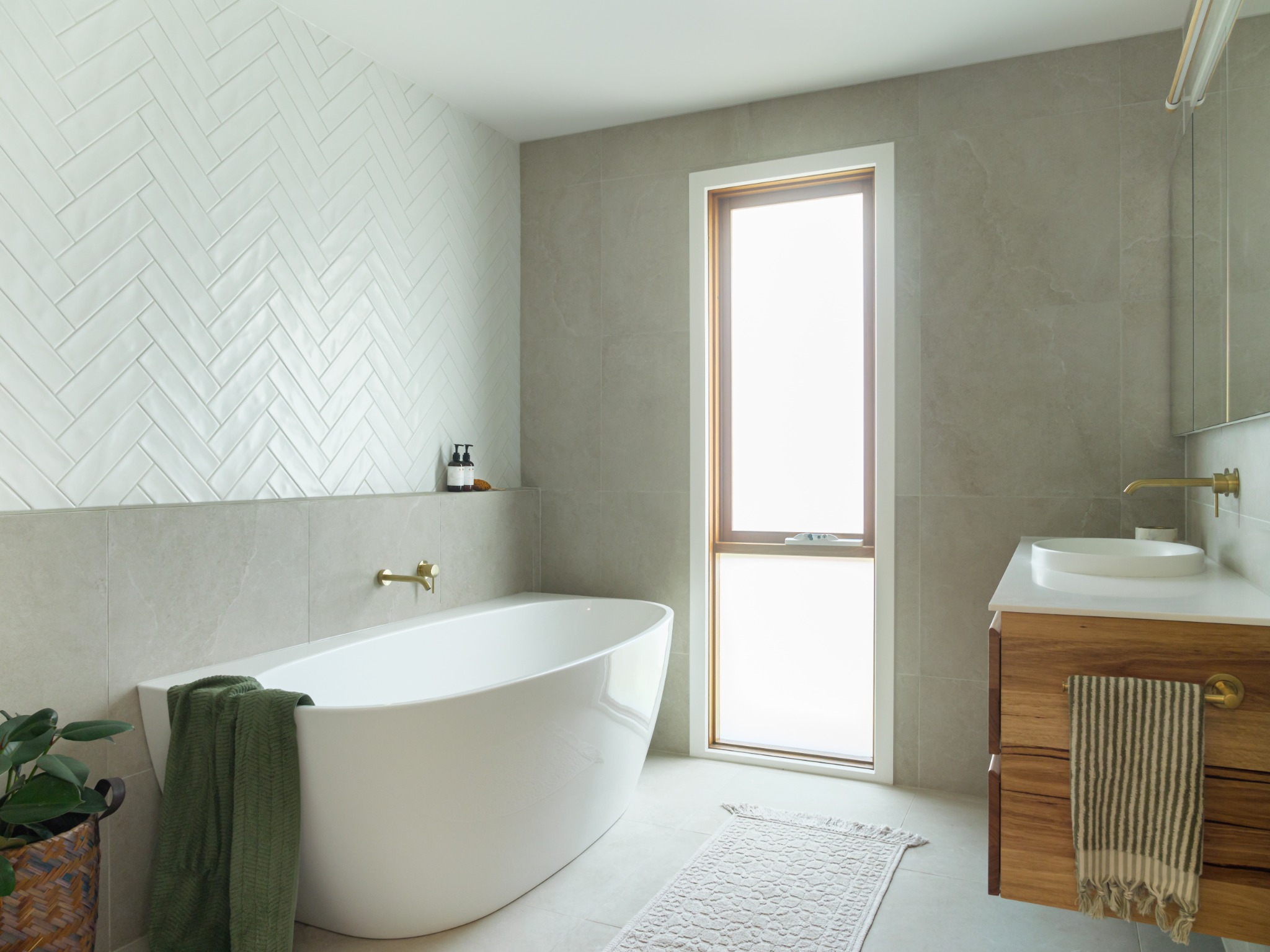 Completed Ringwood bathroom renovation with bath and timber vanity